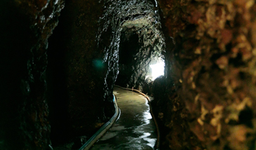 Heading towards the cave hot springs 40m in.